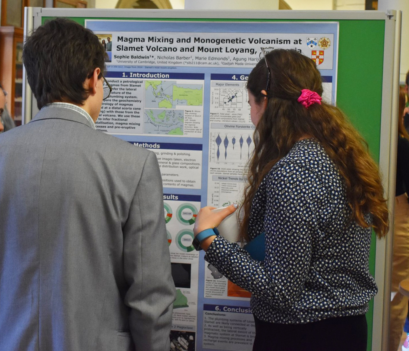 First prize winner Sophie Baldwin discusses her poster with third year students
